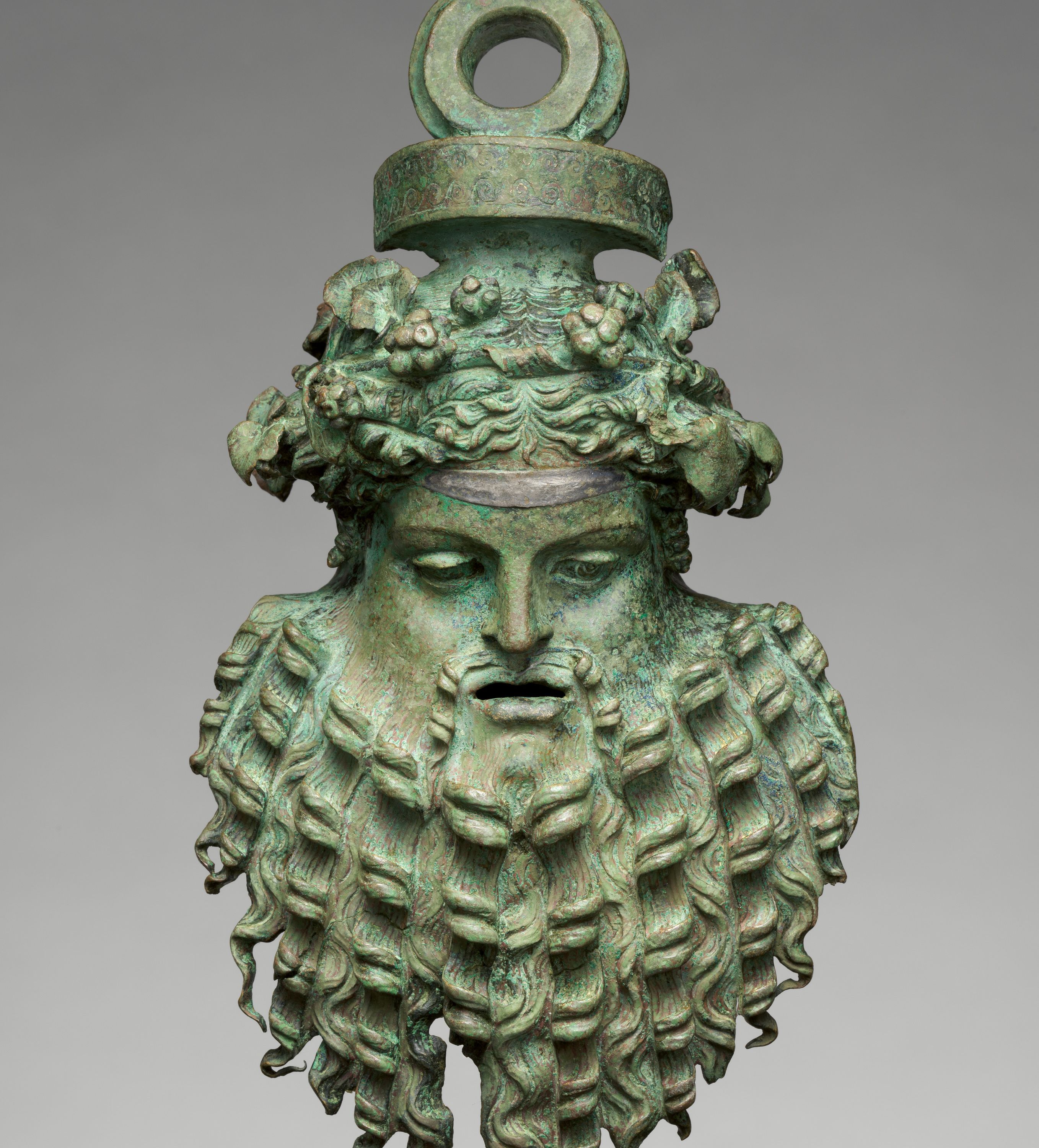 Bronze handle attachment in the form of a mask