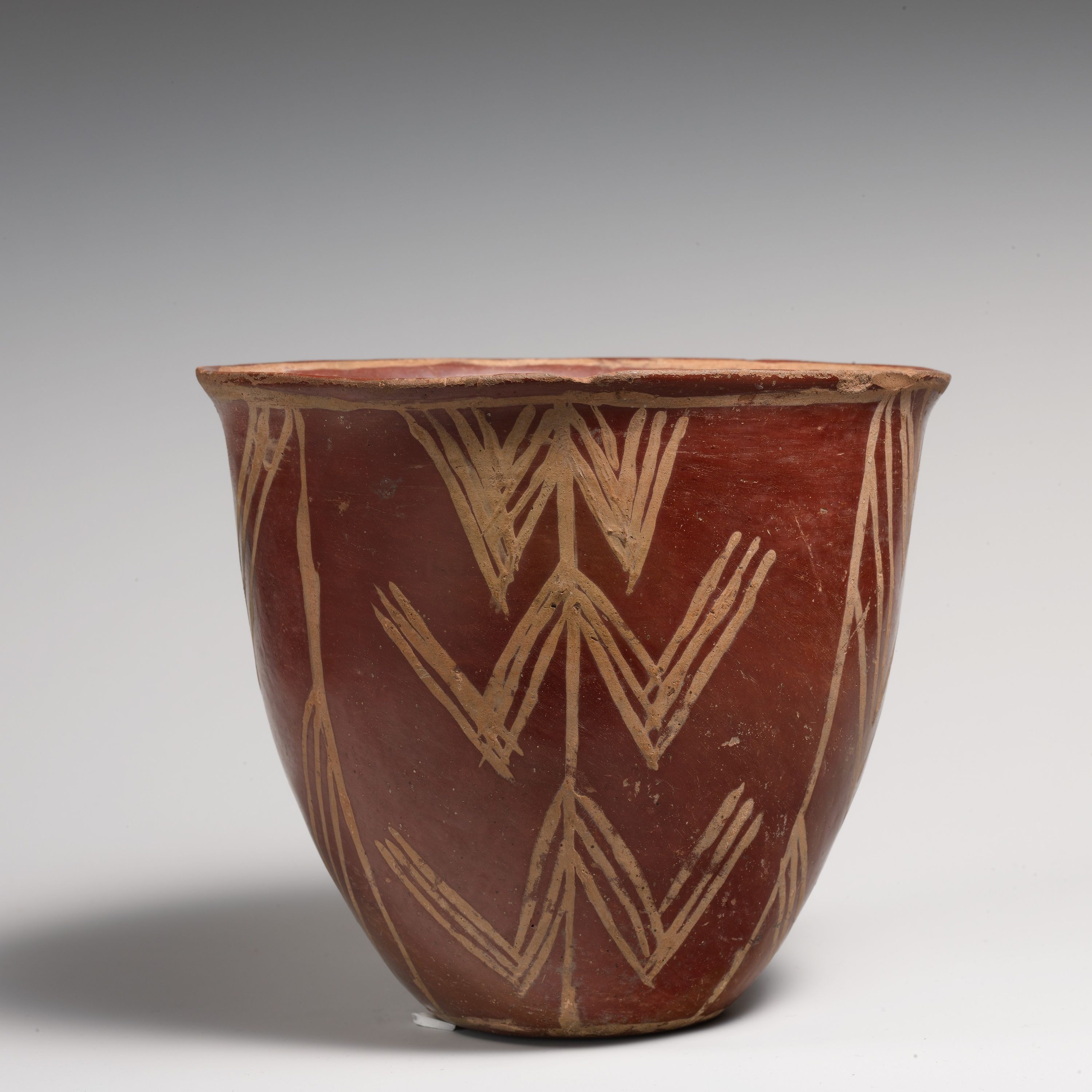 White cross-lined ware bowl with geometric patterns