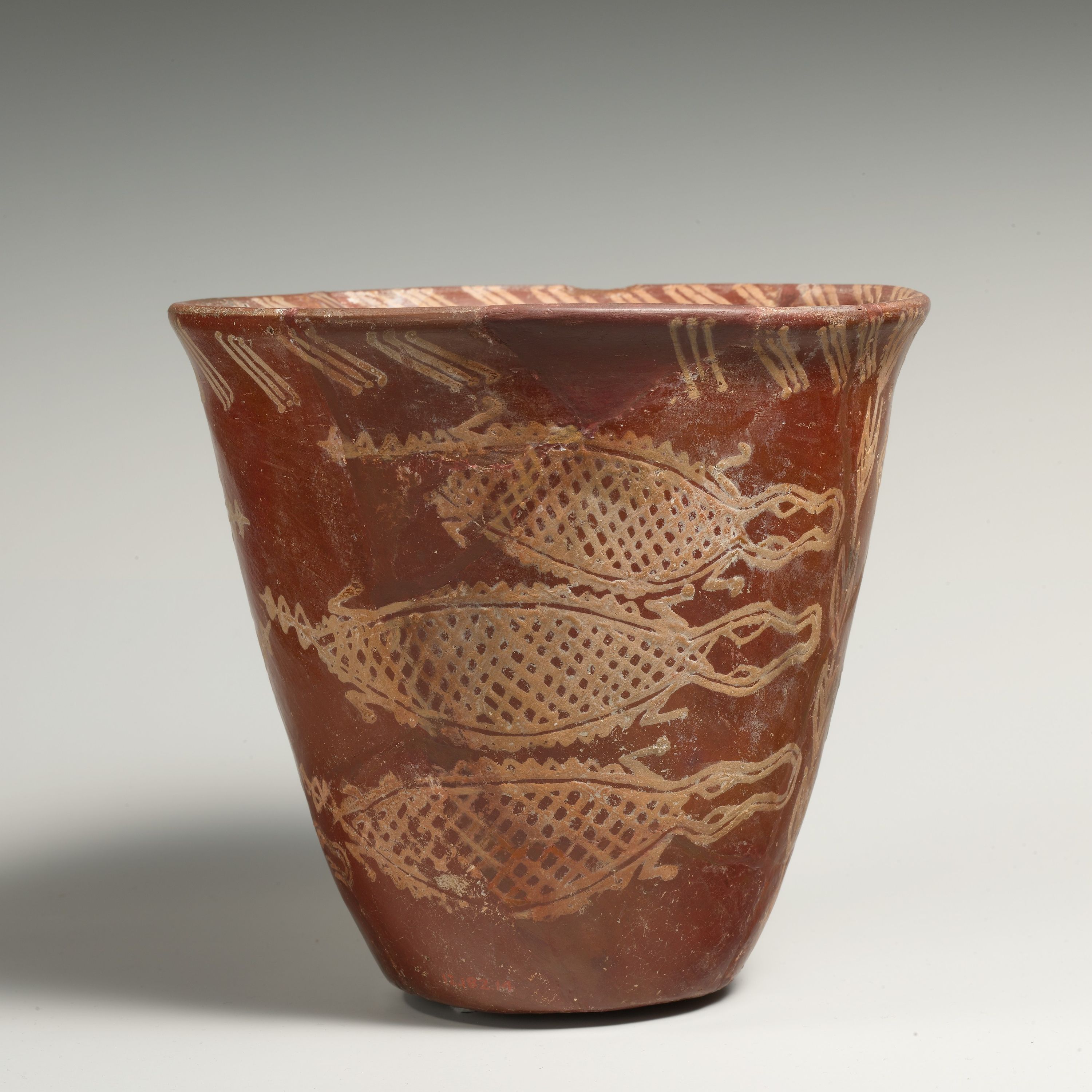 White cross-lined ware beaker with Nile River scene