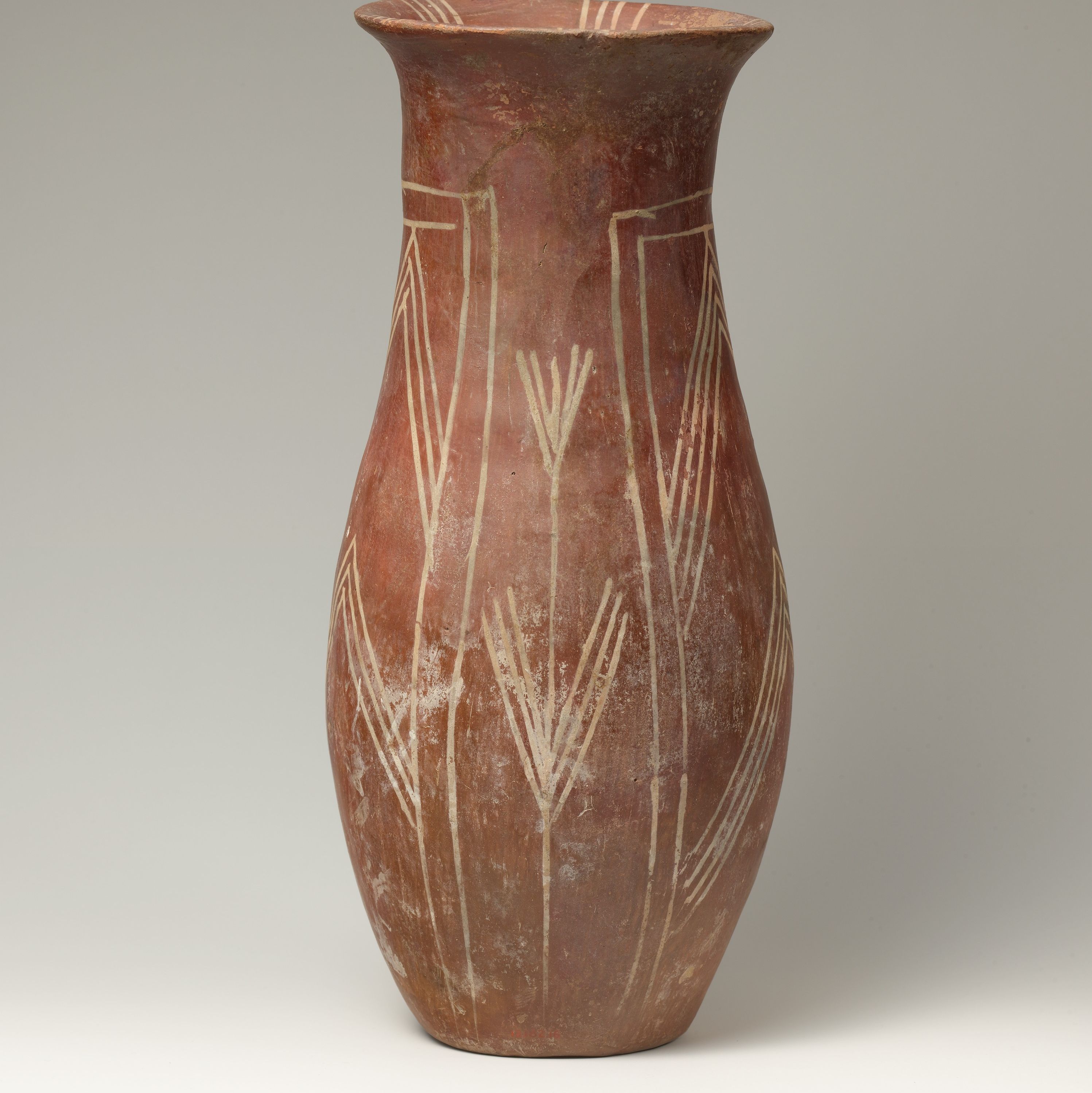 White cross-lined ware vase with plant designs