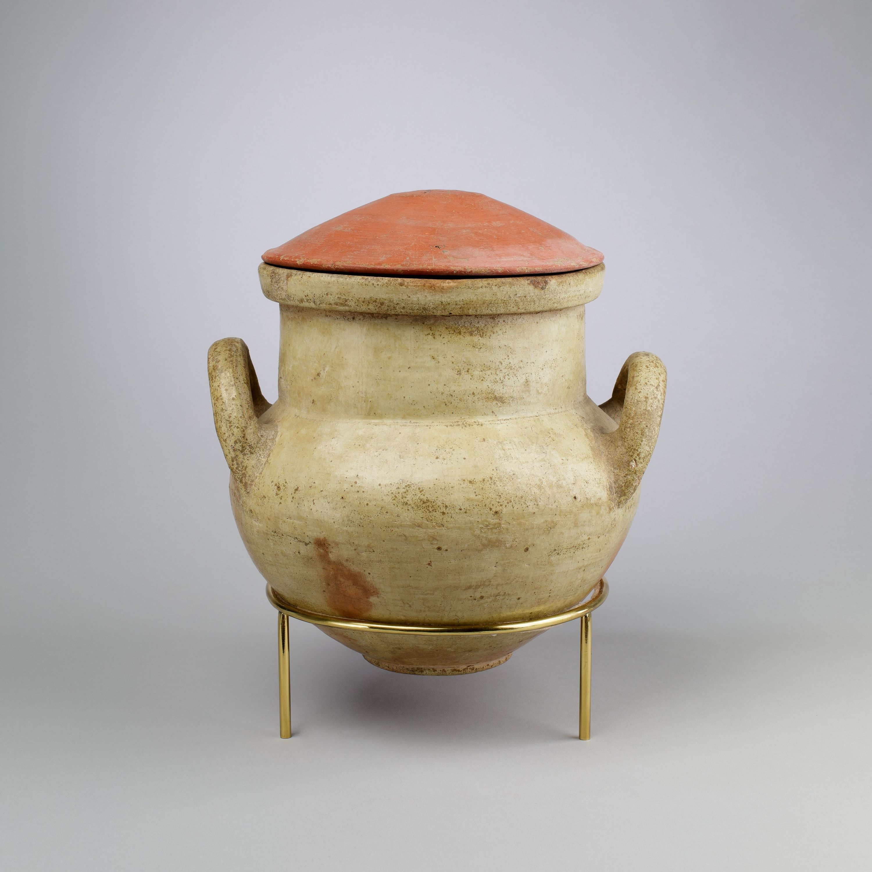 Vessel with strap handles and a lid
