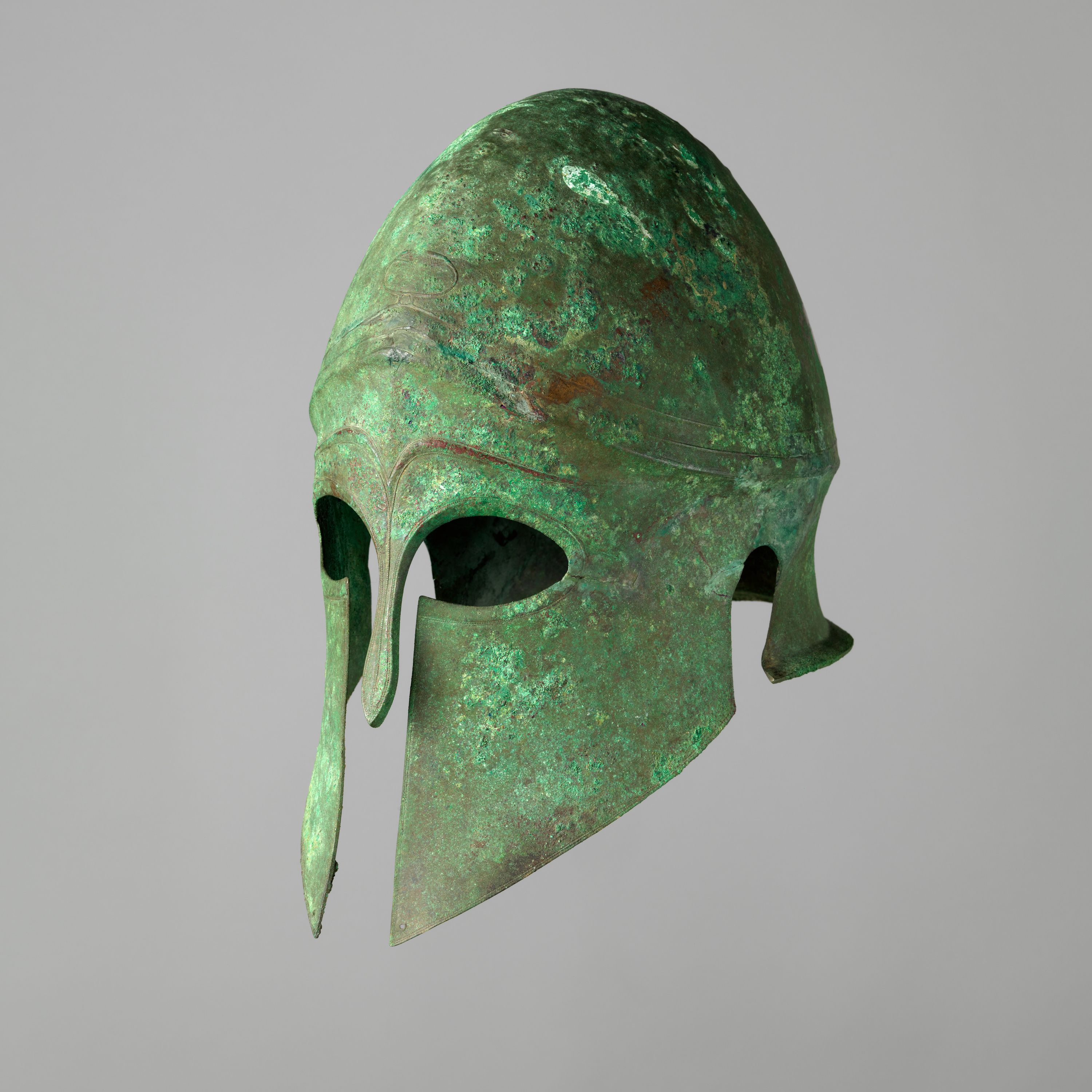 Helmet of the Corinthian Type and Pair of Greaves