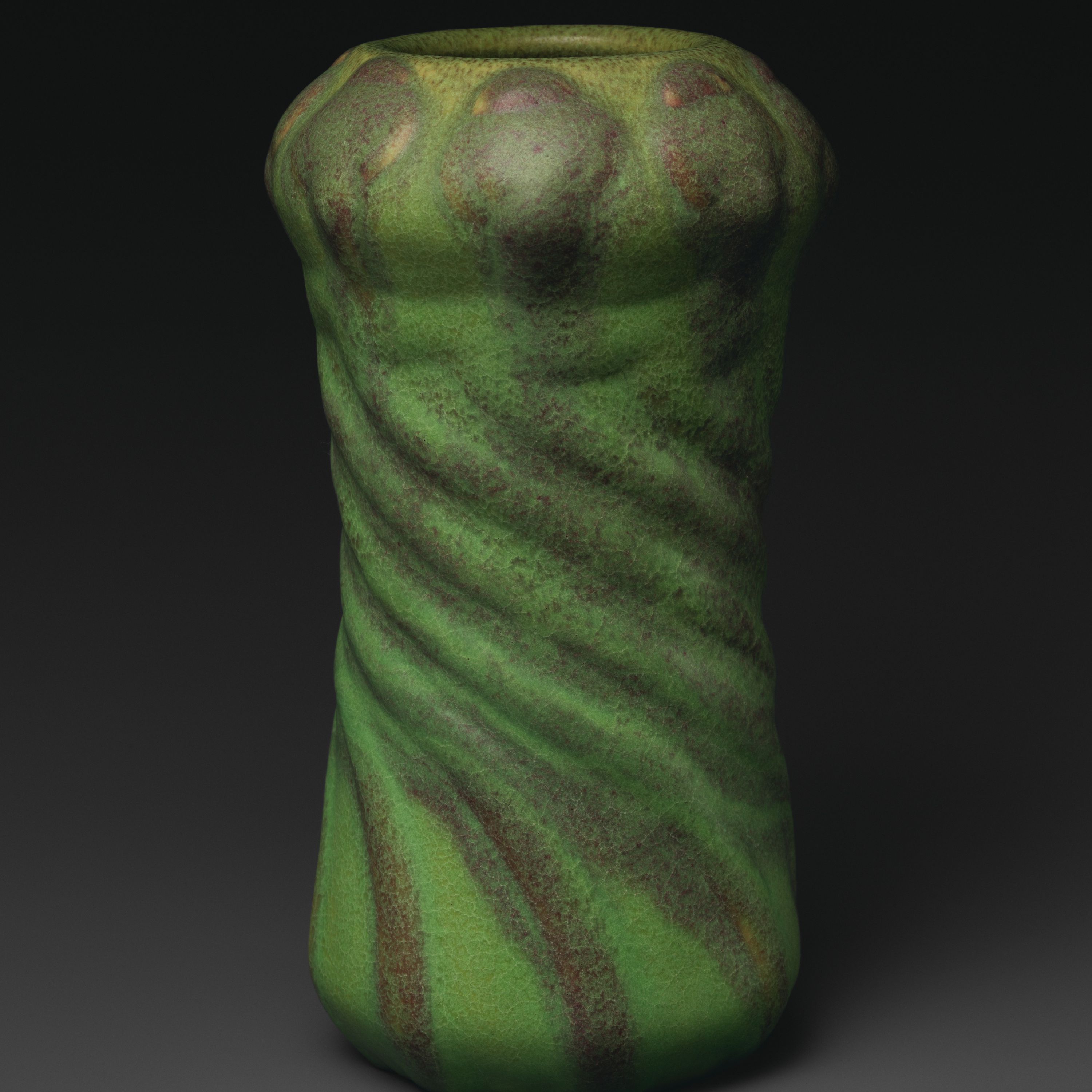 Vase with poppy seed pods by Artus Van Briggle