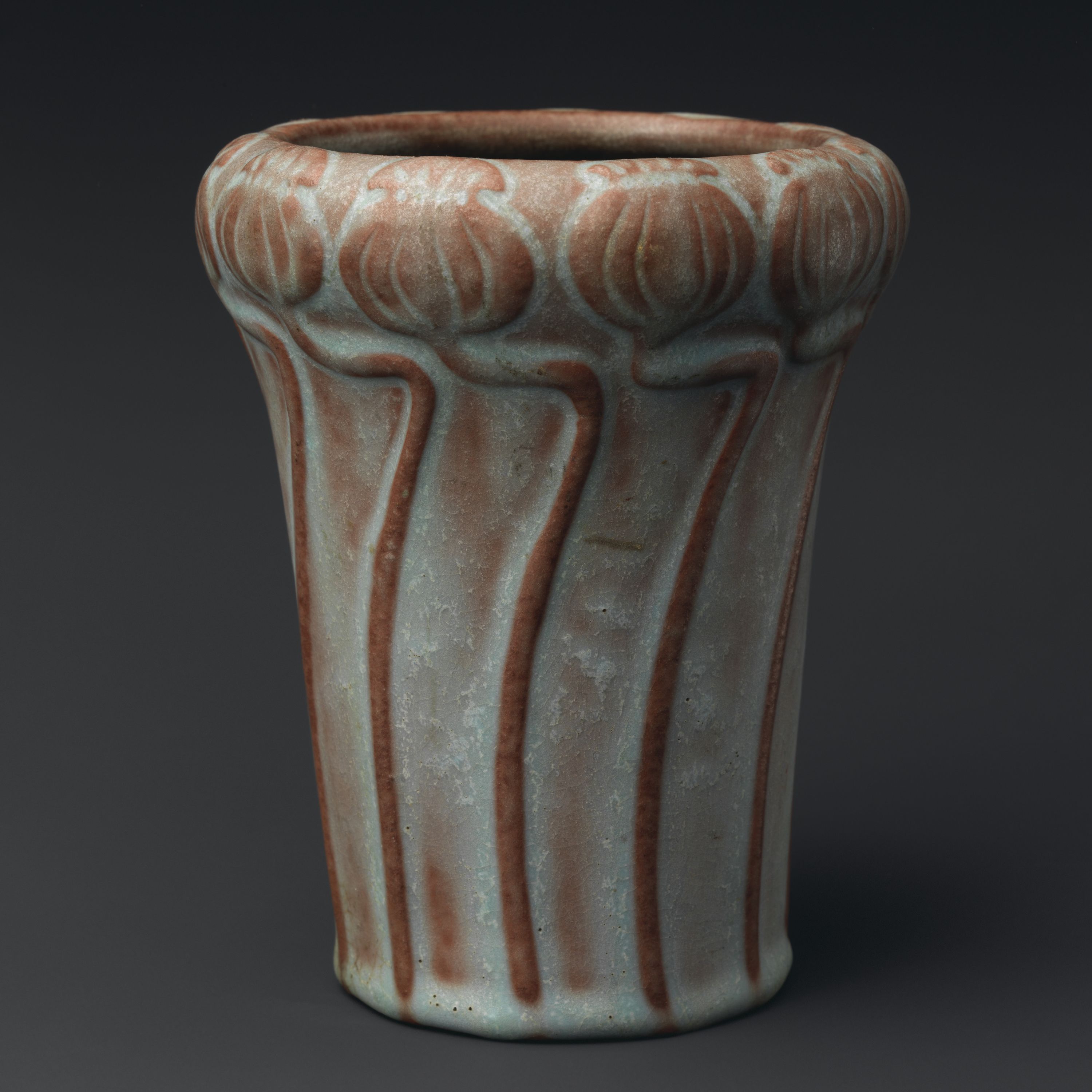 Vase with poppy seed pods by Artus Van Briggle